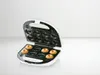 A donut maker with donuts in it, on a white surface. Produktbild-Vorschau