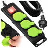 A power strip with three outlets, a switch, and a plug, shown from a diagonal angle. One outlet cover is being opened by a hand. Produktbild-Vorschau