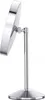 A close-up side view of a silver, modern makeup mirror on a stand, against a white background. Produktbild-Vorschau