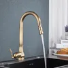 A kitchen faucet with water running into a sink, with books and bread in the background. Náhľad obrázku produktu