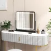 A vanity table with a makeup mirror and accessories. Produktbild-Vorschau