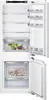 The interior of a white refrigerator with the door open, showing shelves and drawers. Produktbild-Vorschau