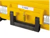 Close-up of the handle and lock of a yellow tool case. Voir les images du produit