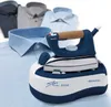 A blue and white steam iron with a cork handle rests on its base, with several folded shirts in the background. Produktbild-Vorschau