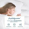 A woman sleeping on a white pillow and sheets, with a graphic overlay describing product features. Produktbild-Vorschau
