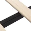 A close-up view of a bed frame's wooden slats and a black metal support beam. Voir les images du produit