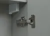 Close-up of a cabinet hinge and a corner bracket inside a grey cabinet. Produktbild-Vorschau