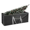 A black storage bag for a Christmas tree, with the tree partially inside. Podgląd zdjęcia produktu