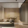 A modern living room with a sofa and a slatted room divider. Anteprima dell’immagine prodotto