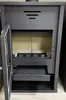 A front view of a black wood-burning stove with its door open. Náhled obrázku produktu