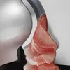 A close-up view of a meat slicer with a slice of ham being cut. Produktbild-Vorschau