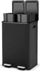 A black dual-compartment trash can with silver foot pedals. Náhled obrázku produktu