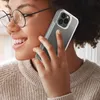 A woman is holding a smartphone to her ear, seemingly in a conversation. Voir les images du produit