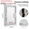 A mirror with decorative elements and dimensions shown. Anteprima dell’immagine prodotto