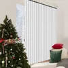 A Christmas tree decorated with ornaments and candy canes is placed next to a window with white vertical blinds. Two decorative pillows, one red and one green, are on a stool in the foreground. Voir les images du produit