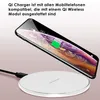A smartphone is wirelessly charging on a white Qi charging pad. Produktbild-Vorschau