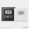 Two smart home thermostats, one in anthracite and one in white, are displayed side-by-side against a light gray background. Produktbild-Vorschau