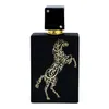 A black perfume bottle with gold Arabic calligraphy shaped like a horse. Produktbild-Vorschau