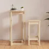 A wooden bar table and stool set against a light pink wall and wooden floor. Náhled obrázku produktu