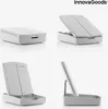 A collage of four images showing a white InnovaGoods makeup organizer with a mirror from different angles. Anteprima dell’immagine prodotto