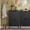 An entryway with a shoe cabinet, coat rack, and decorative items. Náhľad obrázku produktu