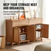A wooden sideboard with open doors, displaying storage compartments and items inside, set in a room with a bed and rug. Anteprima dell’immagine prodotto