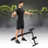 A man is using a fitness bench with resistance bands in a studio setting with smoky effects and neon text. Anteprima dell’immagine prodotto