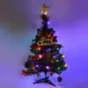 A small, decorated artificial Christmas tree with LED lights and ornaments, set against a gradient background. Produktbild-Vorschau