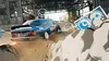 A racing car is drifting around a corner in a garage or industrial area. Produktbild-Vorschau