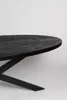 A close-up, side view of a black oval dining table with a black metal base, set against a plain white background. Voir les images du produit