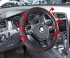 Interior view of a car's steering wheel with red arrows indicating airflow around a steering wheel cover. Podgląd zdjęcia produktu