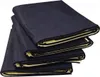 A stack of four dark blue mats with yellow lining, folded and presented on a white background. Produktbild-Vorschau