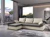 A modern living room with a large sectional sofa, large windows showing a sunset view, and contemporary decor. Náhled obrázku produktu