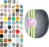 A collage of various toilet seat designs and a single toilet seat with an orchid and bamboo design. Produktbild-Vorschau