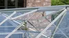 Close-up view of the opening mechanism of a greenhouse roof window. Produktbild-Vorschau