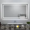 A bathroom mirror with integrated LED lighting, mounted above a sink and countertop. The mirror has a sleek, modern design with a thin frame and a soft, diffused light emanating from its edges. Below the mirror, there are icons representing product feature Produktbild-Vorschau