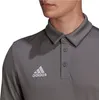Close-up of a man wearing a gray Adidas polo shirt. Podgląd zdjęcia produktu