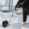 A person is using a battery-powered snow blower in a snowy outdoor environment. Produktbild-Vorschau