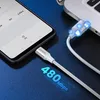 A Ugreen USB-A to USB-C charging cable is shown connecting a smartphone to a laptop, with glowing icons indicating data transfer and charging. Produktbild-Vorschau