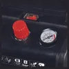 Close-up of the control panel of an air compressor, showing a pressure gauge, a red knob, and a switch. Anteprima dell’immagine prodotto