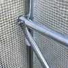 A close-up view of a metal frame joint of a greenhouse, covered by a white mesh fabric. Produktbild-Vorschau