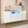 A white sideboard with gold trim and LED lighting is displayed in a room with a pink wall and beige textured wall. Produktbild-Vorschau