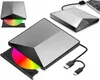 Multiple views of a silver and black external DVD drive, one with a colorful disc inserted, connected to a laptop. Produktbild-Vorschau