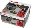 The image shows the packaging of a TEFAL cast iron pot, with images of the pot and food on the box. Náhled obrázku produktu