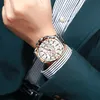 A man wearing a suit and watch. Produktbild-Vorschau