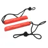 Two orange gaming controller straps with black lanyards are shown against a white background. Produktbild-Vorschau