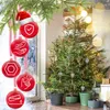 Christmas tree with ornaments, one of which is a Santa hat. Voir les images du produit