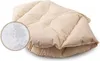 A close-up view of a beige cushion, with a magnified inset showing its filling. Produktbild-Vorschau