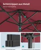 Close-up view of the metal ribs and central pole of a red umbrella, with inset images showing steel profiles and a locking pin. Produktbild-Vorschau