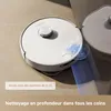 Two robotic vacuum cleaners on a floor, with text overlays highlighting features. Produktbild-Vorschau
